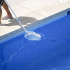 cleaning the bottom of the pool